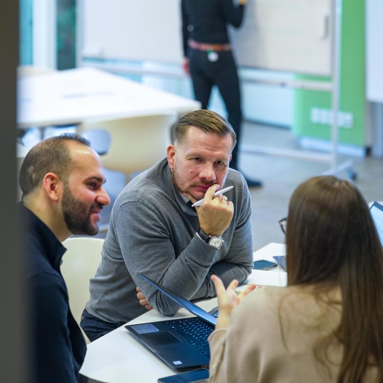 Blue MBA participants during group discussion