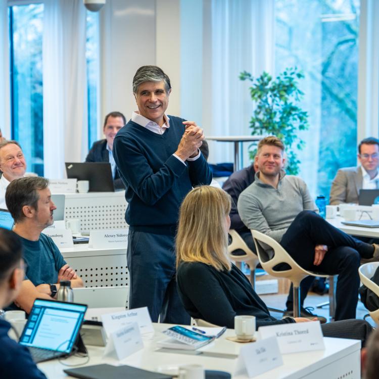 EMBA participants at CBS classroom sharing insights during lecture