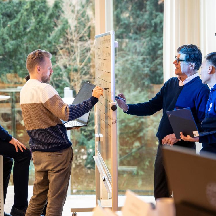 Executive MBA participants working together in class