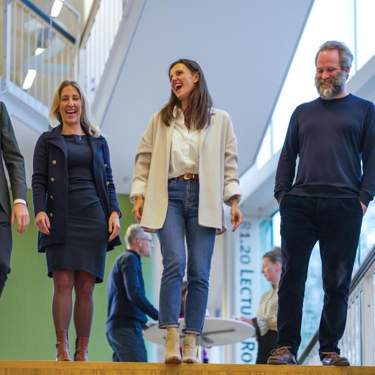 Smiling EMBA participants after lecture