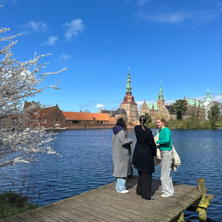 Exchange students by lake and castle