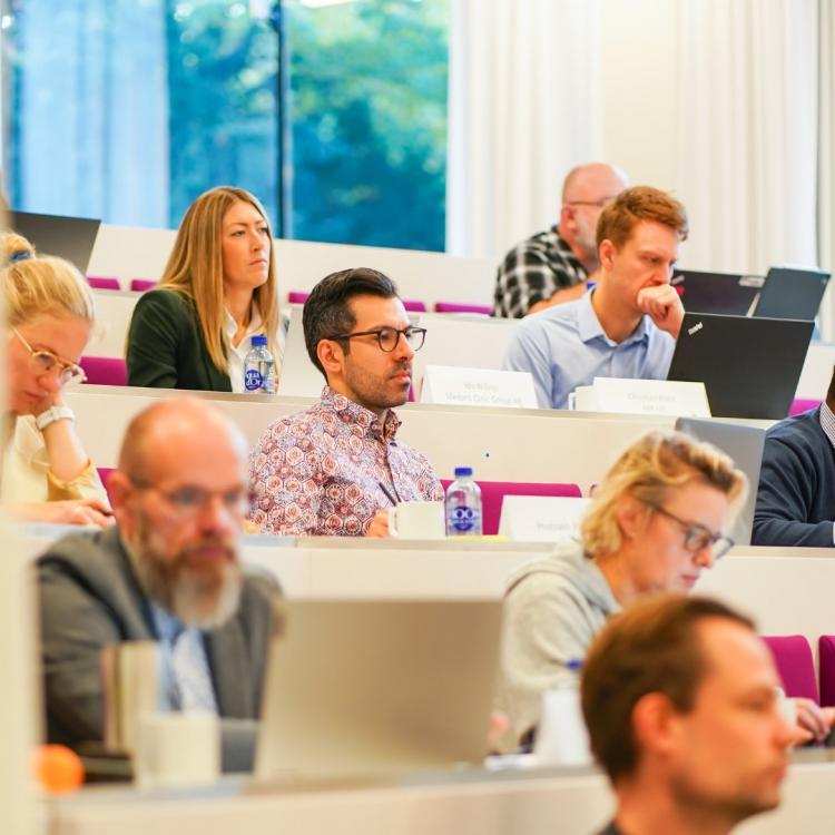 Participants at EMBA in auditorium 