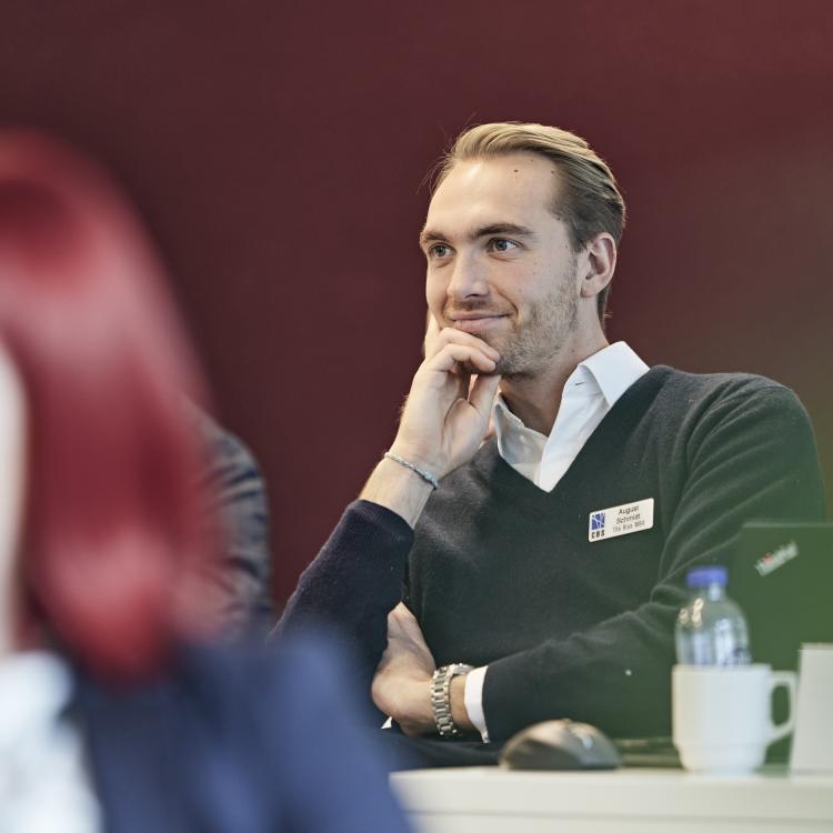 Image of Blue MBA participant paying attention in class