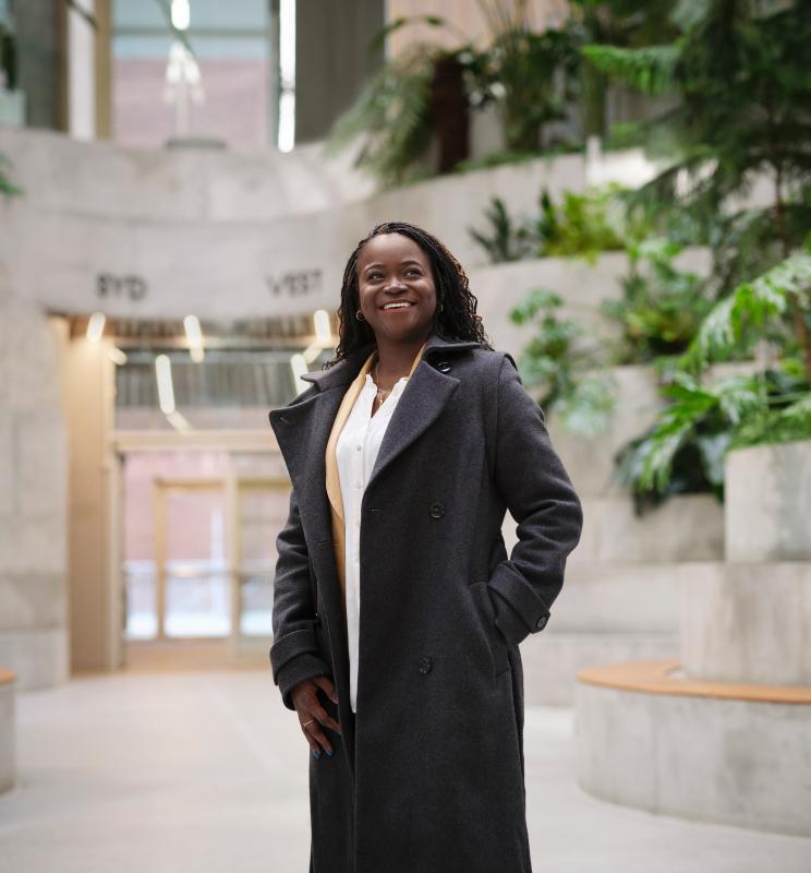 Portrait of Olufunke Ajoke Adebiyi in a modern architectural setting.