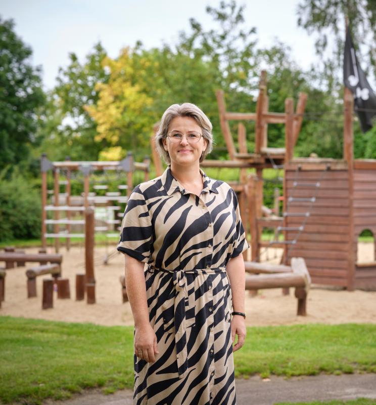 Portrait of Stine Kart Skytte in front of playground