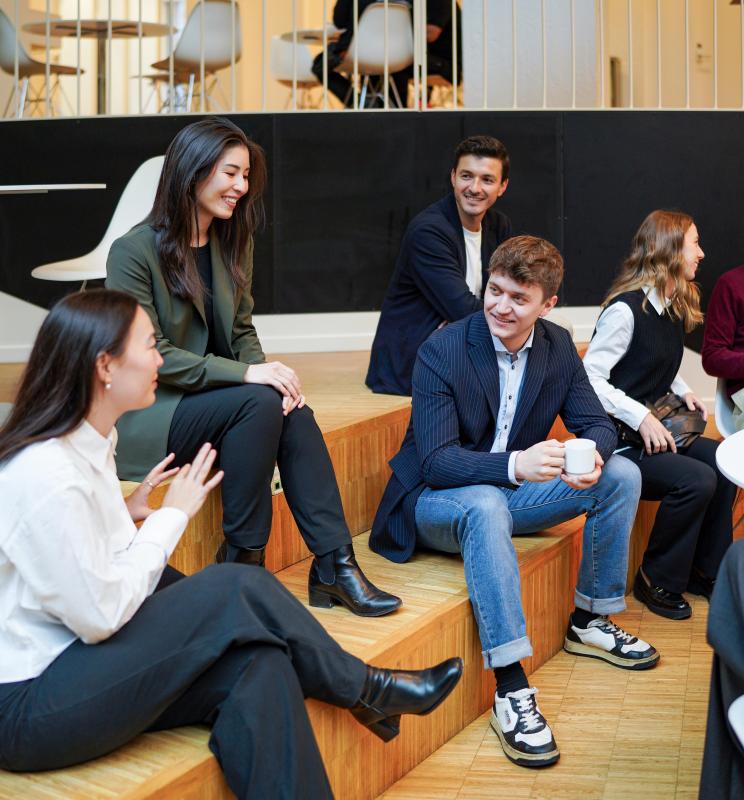 MBA participants networking after class.