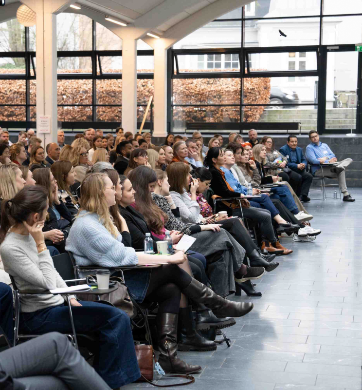 Auditorium filled with participants during Leadership event