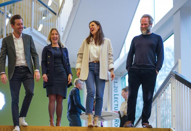 Smiling EMBA participants after lecture
