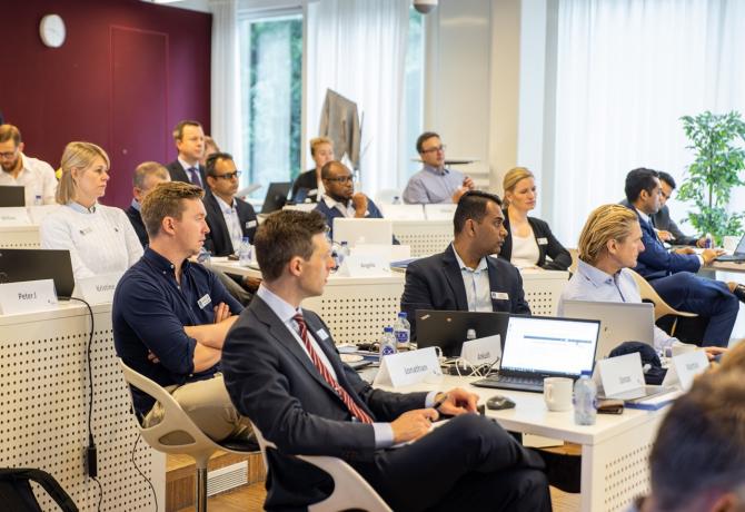 Blue MBA Participants in class