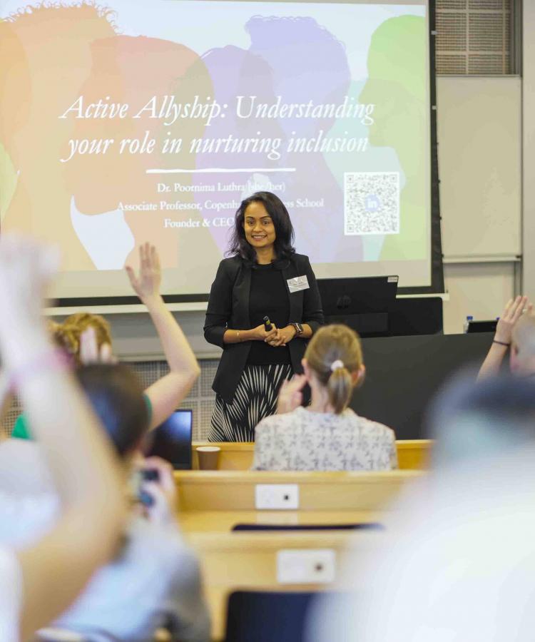Professor Poornima Luthra in a classroom answering questions from students
