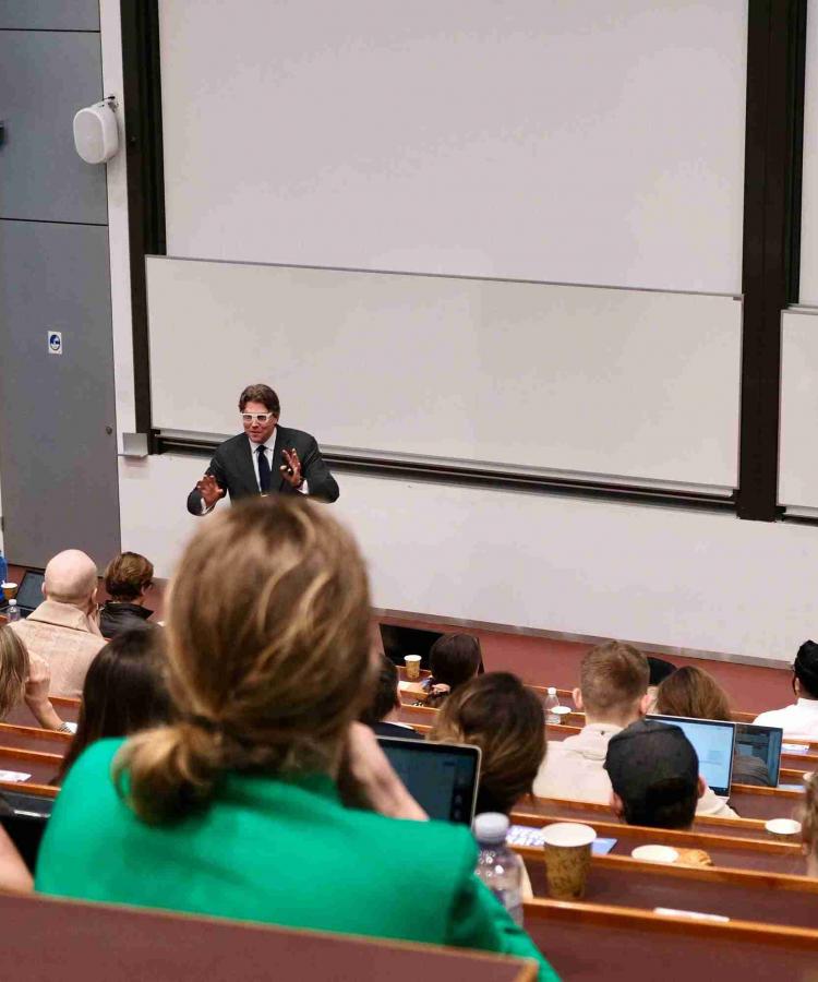 Kristjan Jespersen speaking to auditorium full of attendees at Executive Education event, The end of ESG