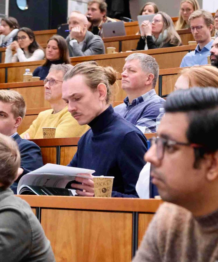 Photograph of attendees sitting in an auditorium at Executive Education event, The end of ESG