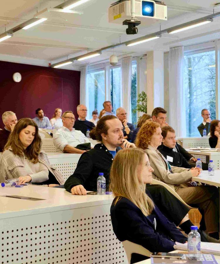 Participants listening to speakers at the Executive Education event, From cycler to ceo
