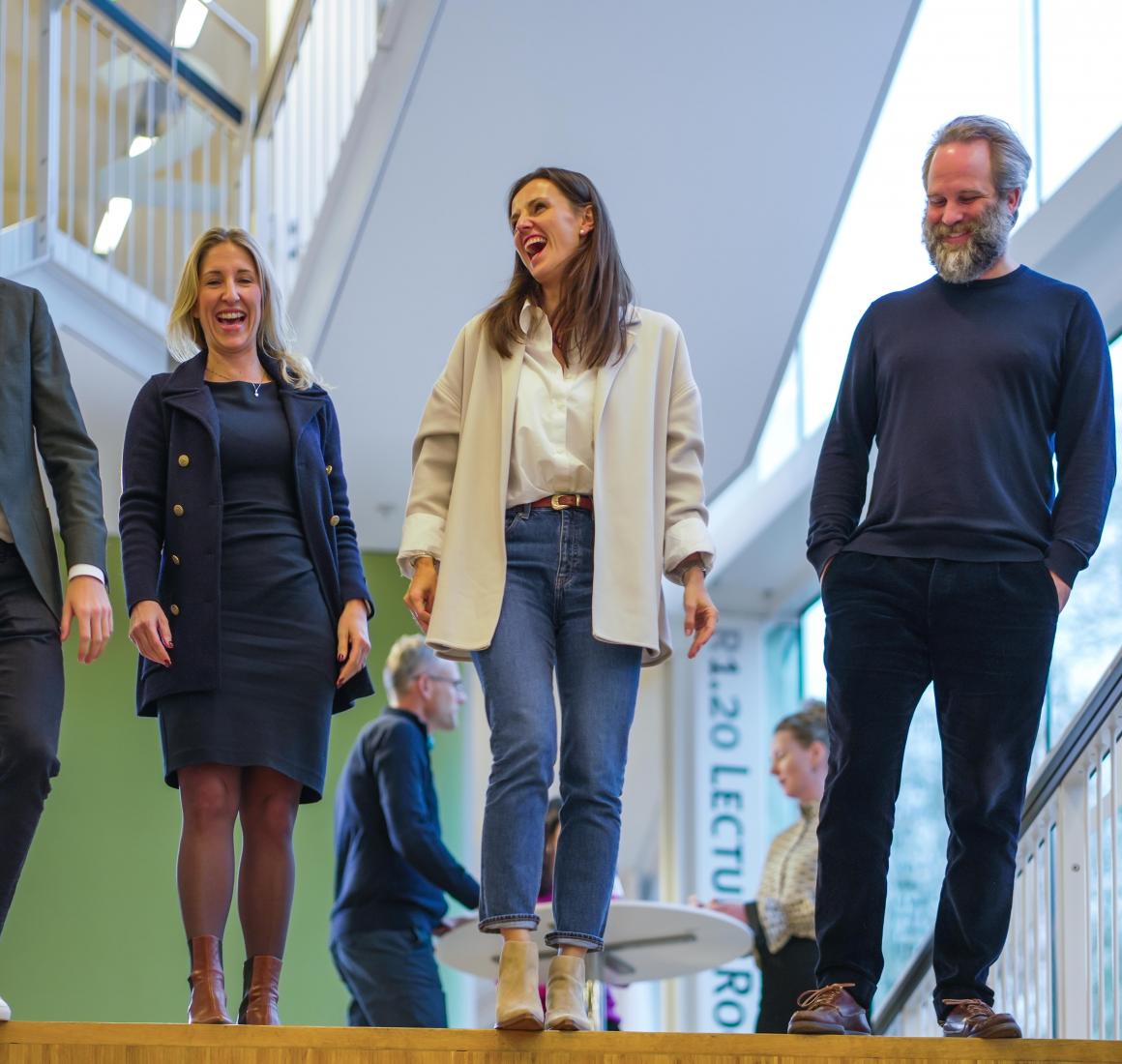 Smiling EMBA participants after lecture