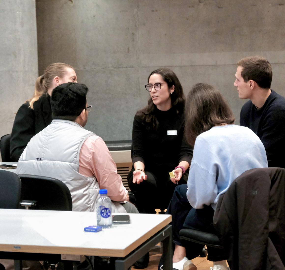 Group of participants engaged in discussion during Executive Education event, Shaping the future of work with AI
