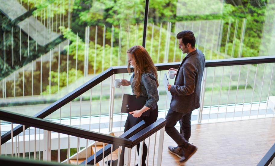 CBS MBA participants walking down the stairs