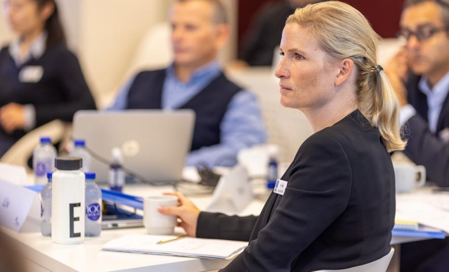 Liv Kjær, Blue MBA alumni, seated at a table during a classroom session