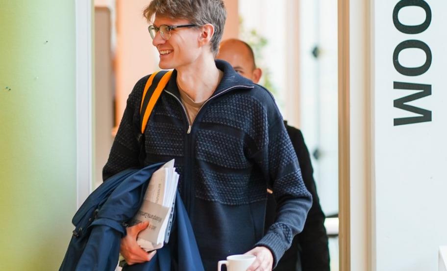 Participant from EMBA walking out of lecture room