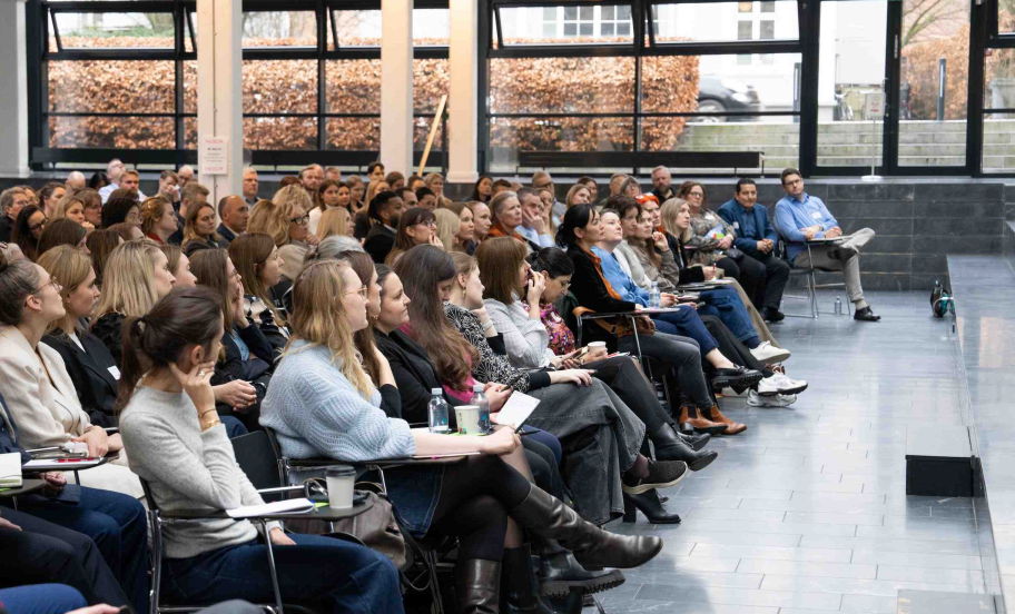 Auditorium filled with participants during Leadership event