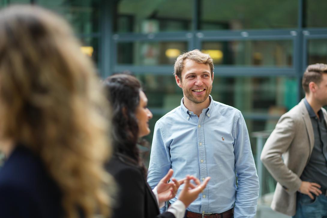 MBA participant Benoit Tanguy talking with his peers.