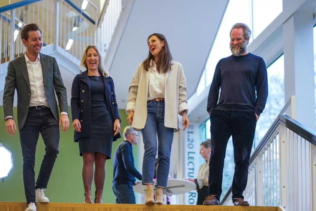 Smiling EMBA participants after lecture
