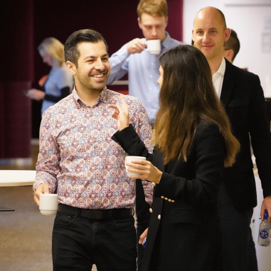 Participants from EMBA drinking coffee and chatting