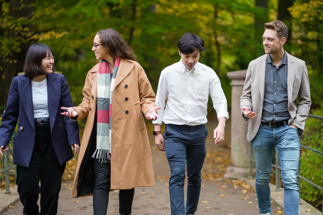 Participants from FTMBA 2022 walking in green surroundings